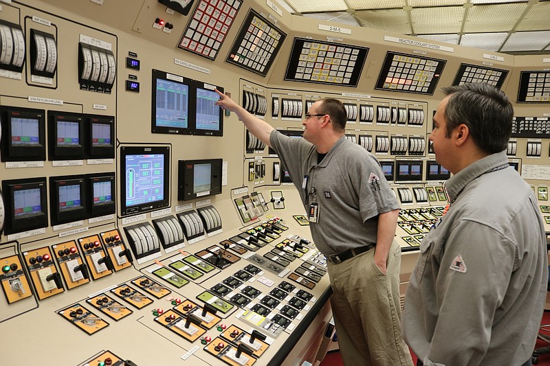 TVA licensed operators at Watts Bar Unit 2 examine data screens as the reactor achieves sustainable nuclear reaction, or criticality, on Monday.