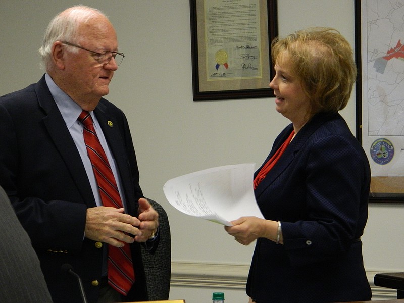 PHOTO BY PAUL LEACH Cleveland Vice Mayor George Poe talks with Assistant City Manager Melinda Carroll between meetings. The City Council appointed Carroll to serve as interim city manager, effective June 1, for up to 90 days.