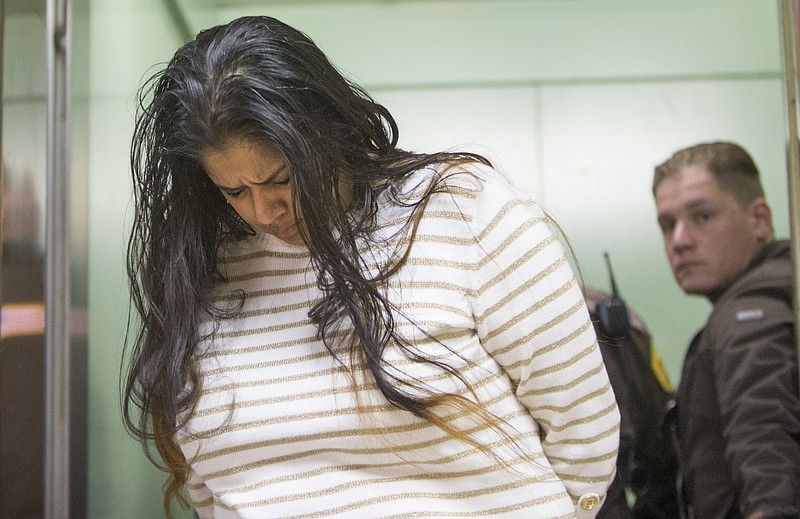 In this March 30, 2015, file photo, Purvi Patel is taken into custody after being sentenced to 20 years in prison for feticide and neglect of a dependent on at the St. Joseph County Courthouse in South Bend, Ind. Attorneys for Patel will urge the Indiana Court of Appeals on Monday, May 23, 2016, to reverse her 2015 convictions on charges of feticide and neglect of a dependent resulting in death. The state's attorney general's office will defend the northern Indiana jury's decision.