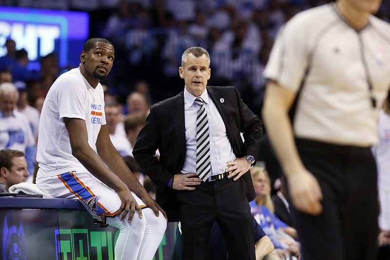 Oklahoma City Thunder forward Kevin Durant (35) and head coach Billy Donovan watch from the sideline against the Golden State Warriors second half in Game 3 of the NBA basketball Western Conference finals in Oklahoma City on Sunday, May 22, 2016.