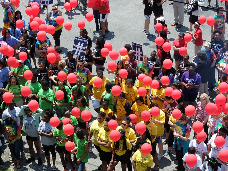 Chattanooga Girls Leadership Academy students hold red balloons to support mentoring in Hamilton County on Tuesday at the Highland Park school. The event was sponsored by the United Way, Mayor Andy Berke and 68 nonprofits and schools.