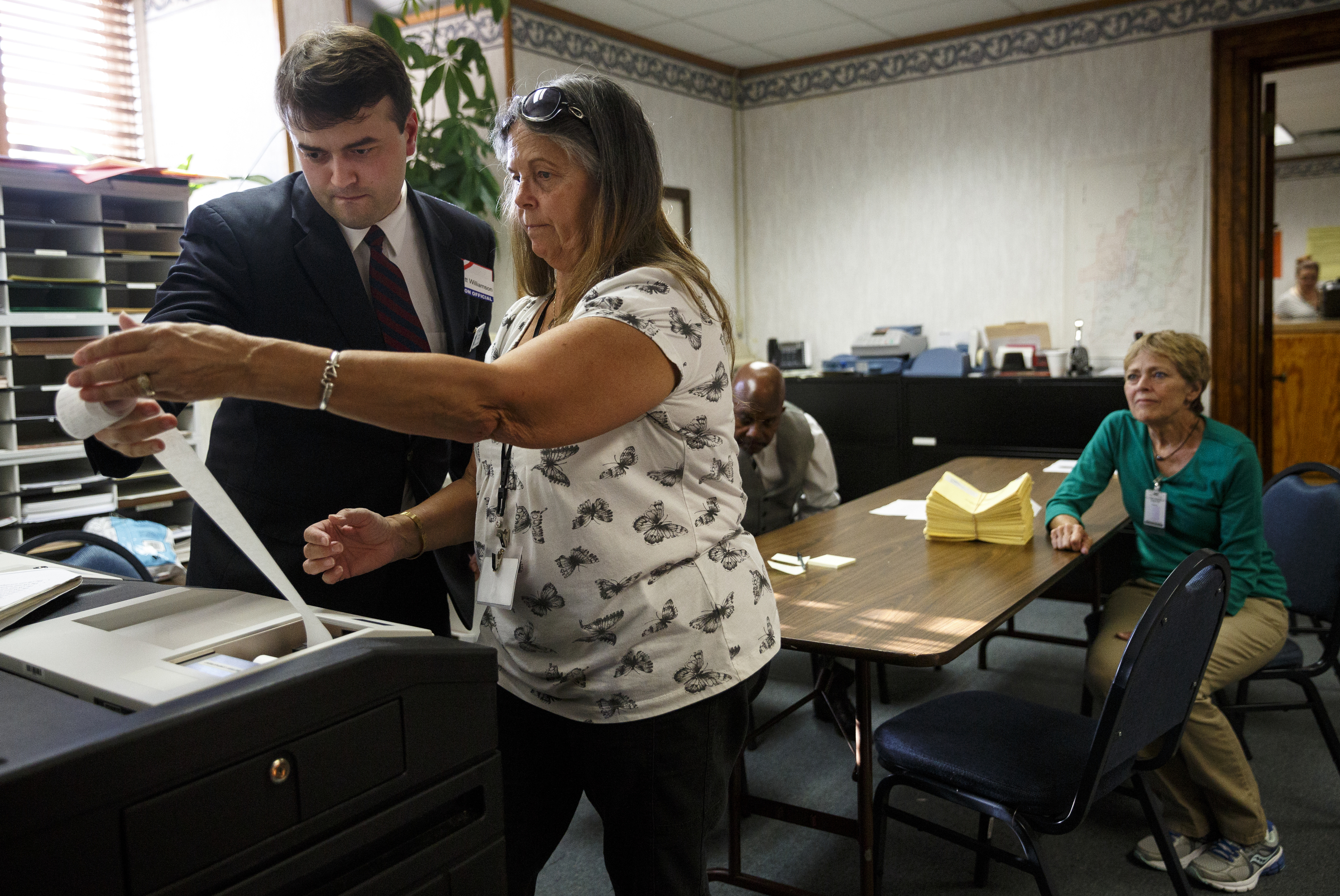 Elections worker Kathy Watkins, right, and Walker County GOP chairman Matthew Williamson check absentee ballot results as they are printed on primary election night at the Walker County Courthouse Tuesday, May 24, 2016, in Lafayette, Ga. GOP primary candidate Shannon Whitfield beat opponent Mike Peardon for his party's nomination and will face incumbent and former GOP member Bebe Heiskell in the fall for Walker County's sole commissioner's seat.