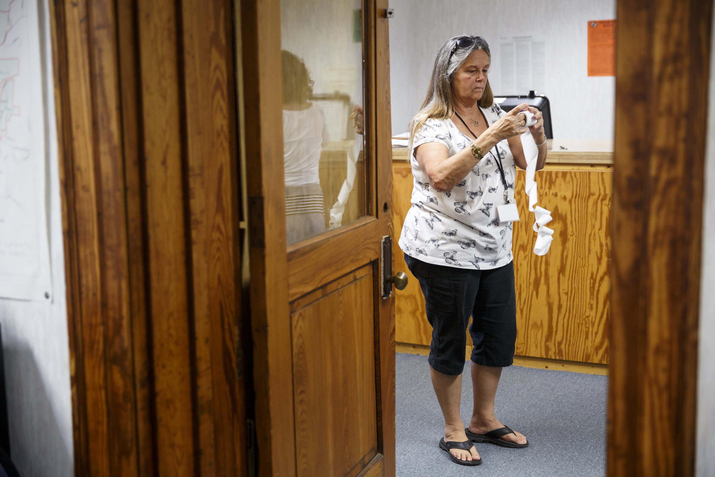 Elections worker Kathy Watkins folds tape with printed election results during ballot counting on primary election night at the Walker County Courthouse Tuesday, May 24, 2016, in Lafayette, Ga. GOP primary candidate Shannon Whitfield beat opponent Mike Peardon for his party's nomination and will face incumbent and former GOP member Bebe Heiskell in the fall for Walker County's sole commissioner's seat.