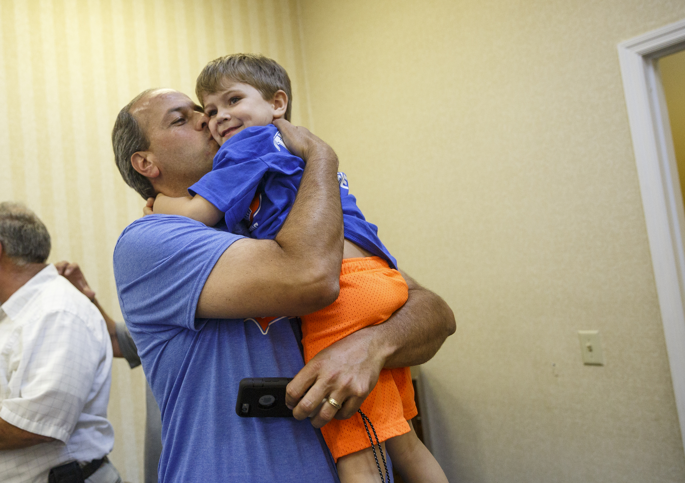 Walker County GOP primary candidate Shannon Whitfield kisses his son Daniel after arriving at his party on primary election night Tuesday, May 24, 2016, in Lafayette, Ga. Whitfield beat opponent Mike Peardon for his party's nomination and will face incumbent and former GOP member Bebe Heiskell in the fall for Walker County's sole commissioner's seat.