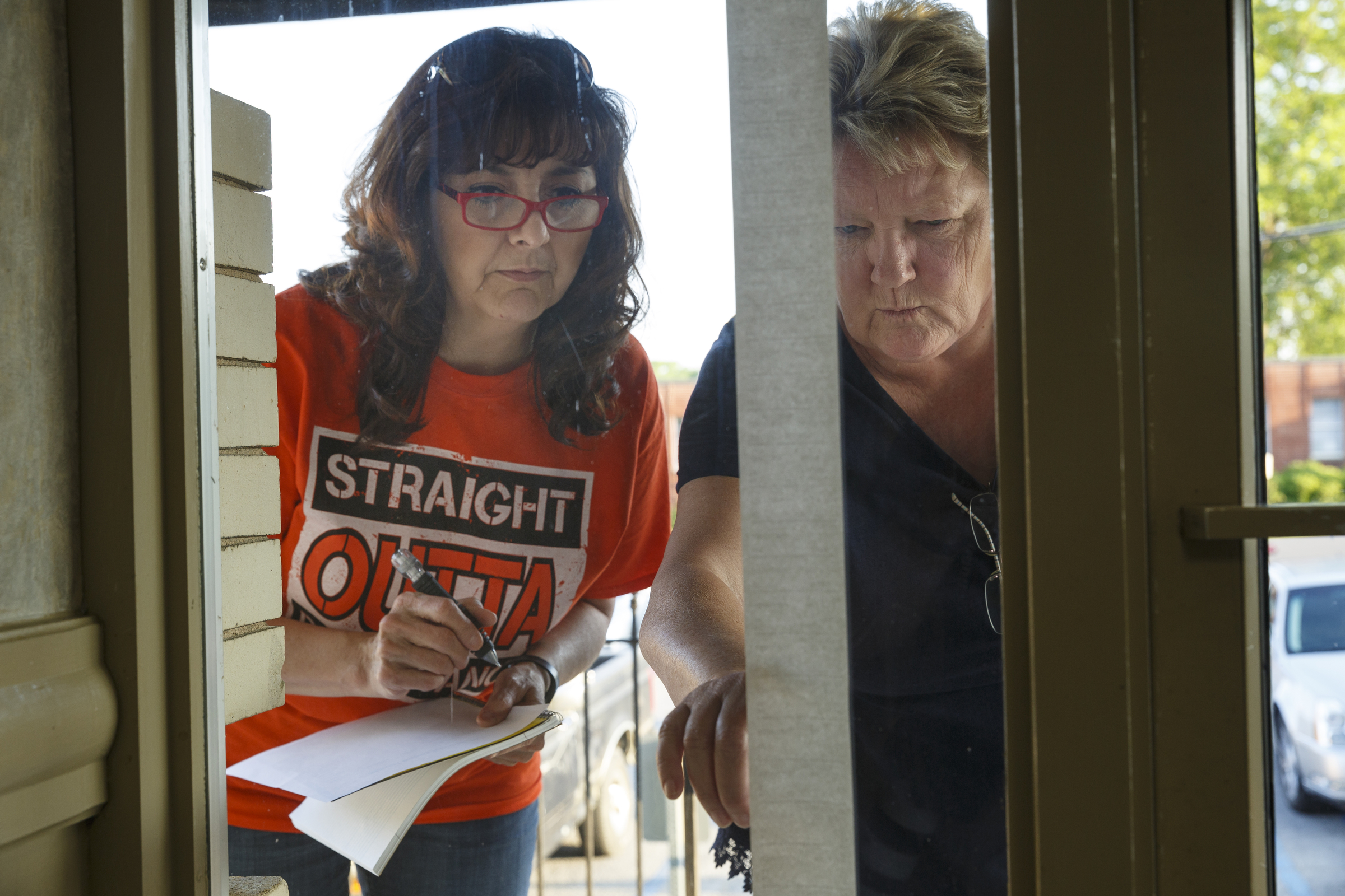 Janet Cobb, left, and Karen Stoker check posted election results on the courthouse window on primary election night at the Walker County Courthouse Tuesday, May 24, 2016, in Lafayette, Ga. GOP primary candidate Shannon Whitfield beat opponent Mike Peardon for his party's nomination and will face incumbent and former GOP member Bebe Heiskell in the fall for Walker County's sole commissioner's seat.