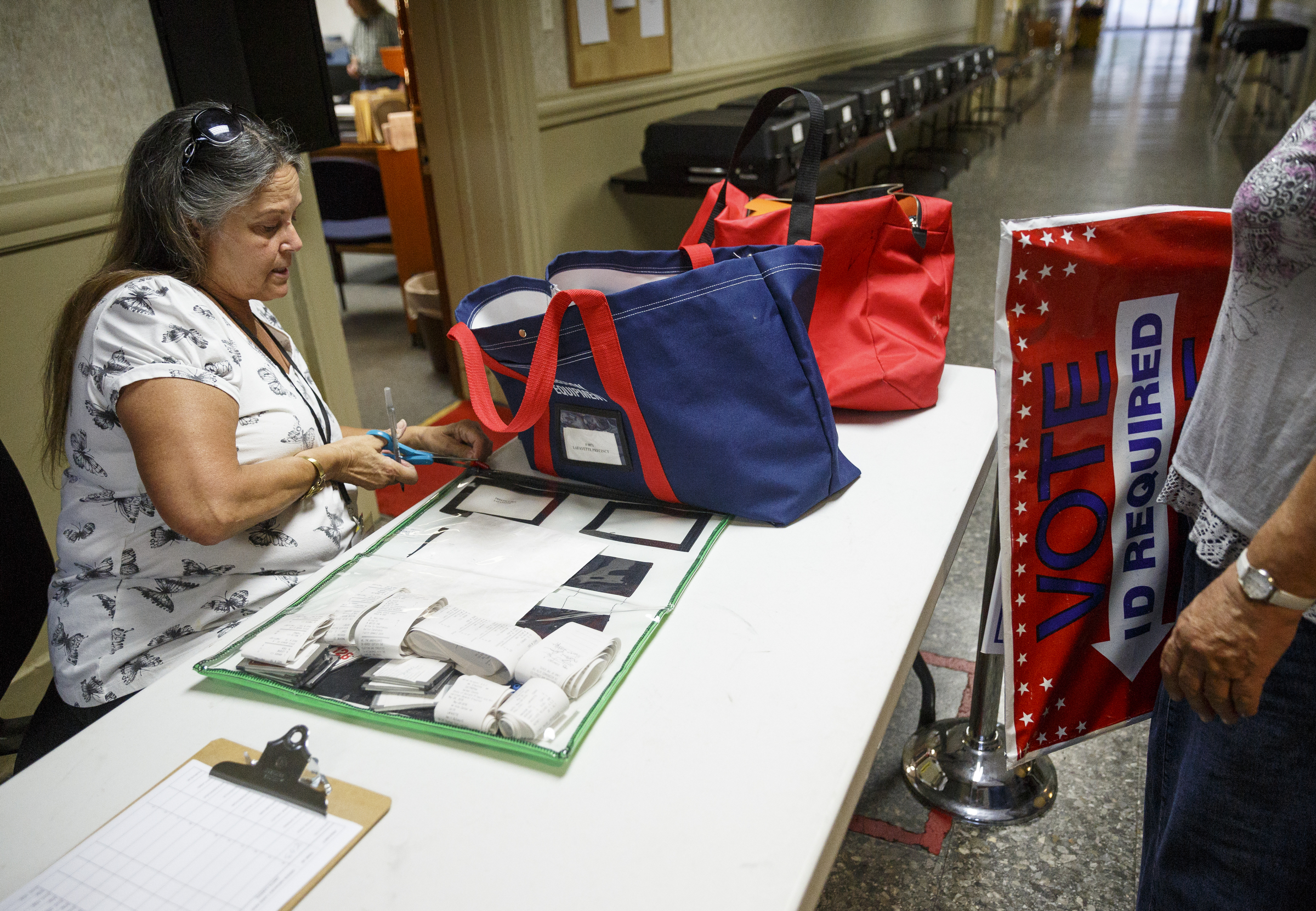 Election worker Kathy Watkins collects election materials from a precinct's workers on primary election night at the Walker County Courthouse Tuesday, May 24, 2016, in Lafayette, Ga. GOP primary candidate Shannon Whitfield beat opponent Mike Peardon for his party's nomination and will face incumbent and former GOP member Bebe Heiskell in the fall for Walker County's sole commissioner's seat.