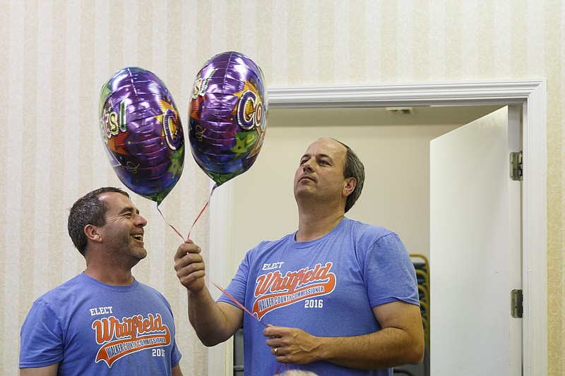 Walker County GOP primary candidate Shannon Whitfield, right, takes two "congratulations" balloons from John Logan on primary election night Tuesday, May 24, 2016, in Lafayette, Ga. Whitfield beat opponent Mike Peardon for his party's nomination and will face incumbent and former GOP member Bebe Heiskell for Walker County's sole commissioner's seat.