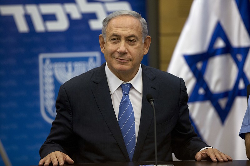 
              Israeli Prime Minister Benjamin Netanyahu, looks on during a faction meeting at the Knesset, Israel's parliament in Jerusalem, Monday, May 23, 2016. Israel's leader on Monday reiterated his support for the establishment of a Palestinian state, seeking to persuade critics that he remains committed to peace as he prepares to bring a polarizing hardliner into his Cabinet. (AP Photo/Sebastian Scheiner)
            