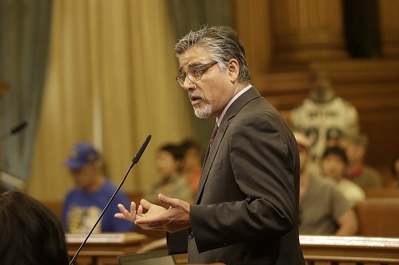 
              FILE - In this May 10, 2016 file photo, Supervisor John Avalos speaks during a Board of Supervisors meeting at City Hall in San Francisco. San Francisco officials plan to take another run at clarifying sanctuary protections for people who are in the country illegally, a policy that landed the city in national hot water last year when a Mexican man shot and killed a woman walking along a waterfront pier. The Board of Supervisors will consider a proposal Tuesday, May 24, 2016, that spells out when law enforcement can turn over criminal suspects to federal immigration authorities. (AP Photo/Jeff Chiu, File)
            