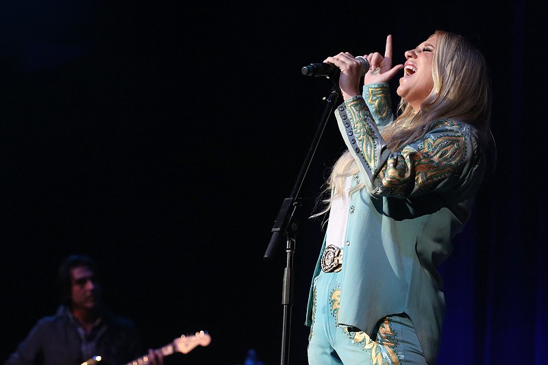 
              Artist Kesha sings "I Shall Be Released" at the Dylan Fest at Ryman Auditorium on Monday, May 23, 2016, in Nashville, Tenn. (Photo by Laura Roberts/Invision/AP)
            