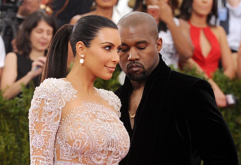 
              FILE - In this May 4, 2015, file photo, Kim Kardashian, left, and Kanye West arrive at The Metropolitan Museum of Art's Costume Institute benefit gala in New York. Kardashian posted a tribute to West on Instagram to mark the couple's second wedding anniversary on May 24, 2016. (Photo by Charles Sykes/Invision/AP, File)
            