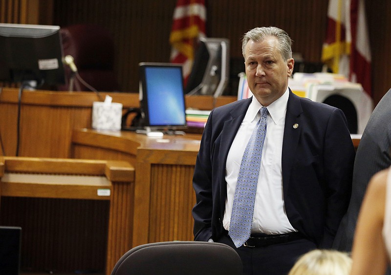 
              Alabama House Speaker Mike Hubbard stands in Judge Jacob Walkers courtroom before the start of his ethics trial on Tuesday, May 24, 2016  in Opelika, Ala. Hubbard is on trial on 23 felony ethics violations that could result in his removal from office.  (Todd J. Van Emst/Opelika-Auburn News via AP, Pool)
            