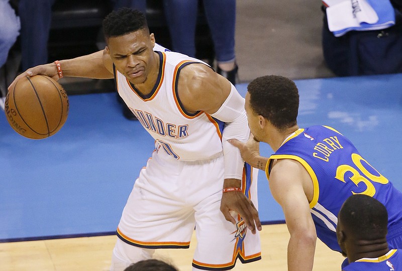 Oklahoma City Thunder guard Russell Westbrook (0) is defended by Golden State Warriors guard Stephen Curry (30) during the first half in Game 4 of the NBA basketball Western Conference finals in Oklahoma City on Tuesday, May 24, 2016.