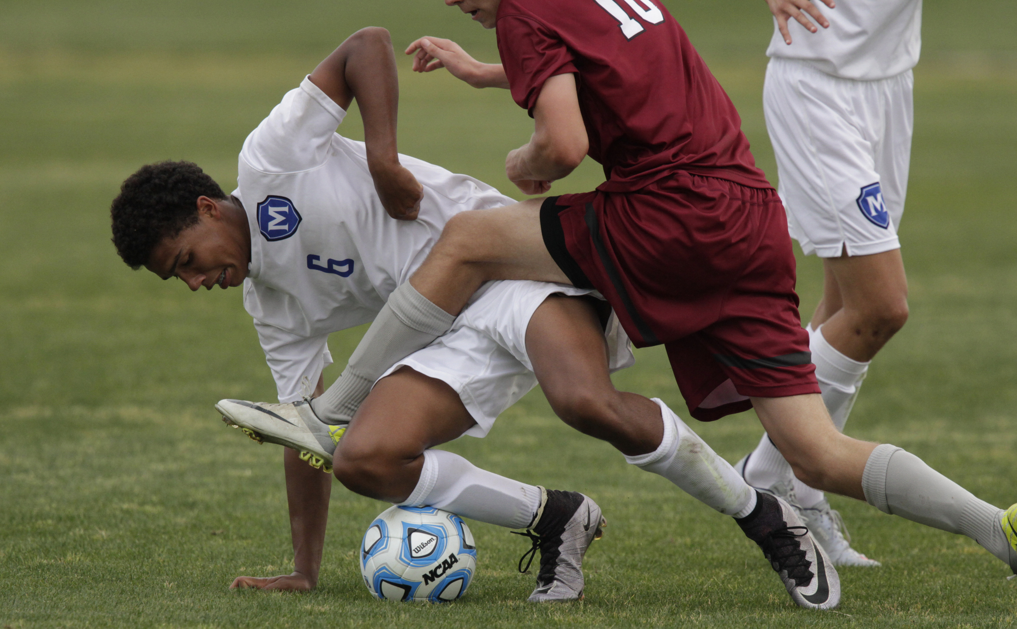 Staff Photo by Dan Henry / The Chattanooga Times Free Press- 5/25/16. McCallie School's Stone Roebuck Jr. (6) gets tangled up with Montgomery Bell Academy's Collin Ragsdale (10) during the 2016 TSSAA Division II State Soccer Championship Match at the Richard Siegel Soccer Complex in Murfreesboro, TN., on May 25, 2016. McCallie lost 0-1.