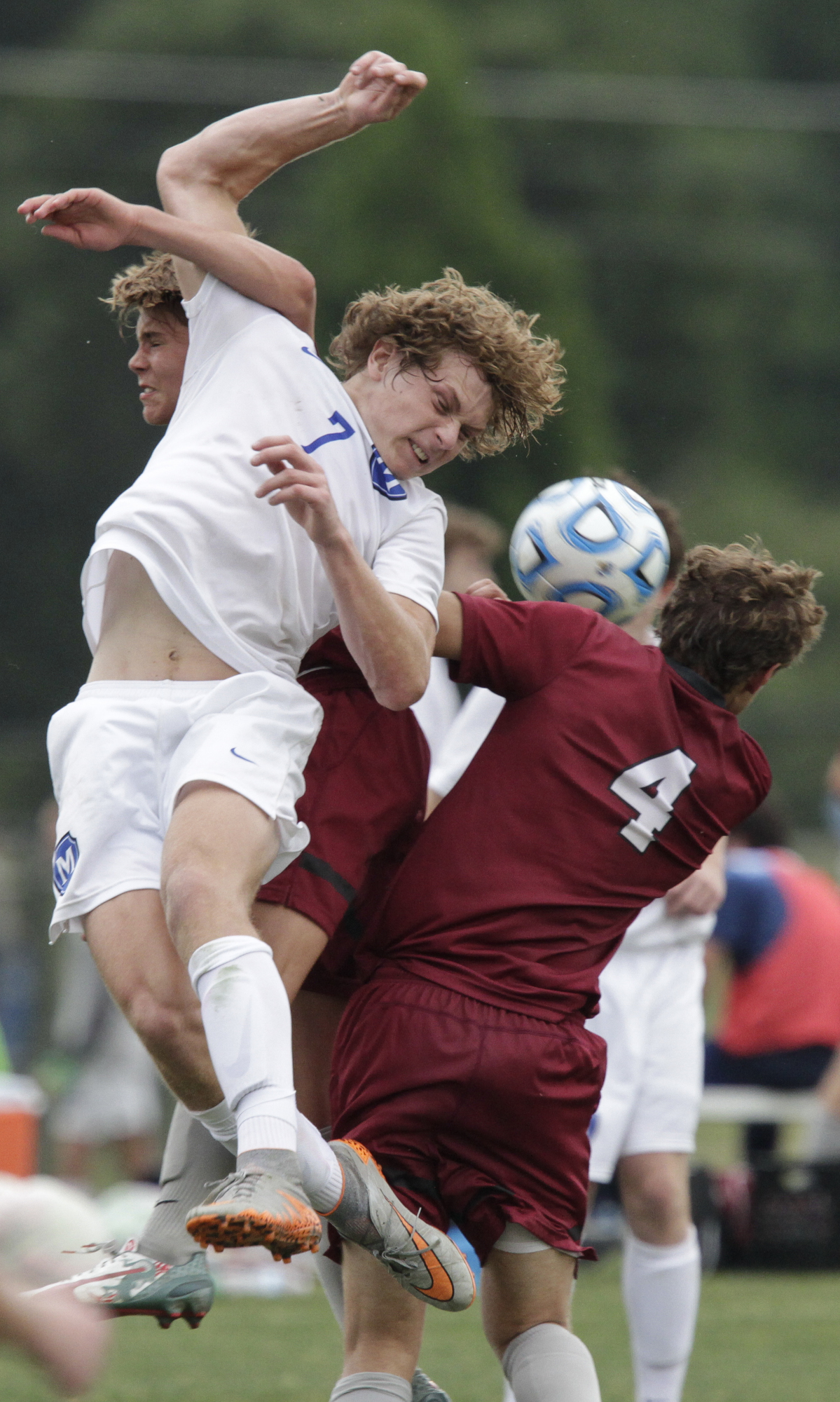 Staff Photo by Dan Henry / The Chattanooga Times Free Press- 5/25/16. McCallie School's Jonah Bryan (7) wins the header over Montgomery Bell Academy's Henry Hylbert (9) and Luke Bernatavitz (4) during the 2016 TSSAA Division II State Soccer Championship Match at the Richard Siegel Soccer Complex in Murfreesboro, TN., on May 25, 2016. McCallie lost 0-1.