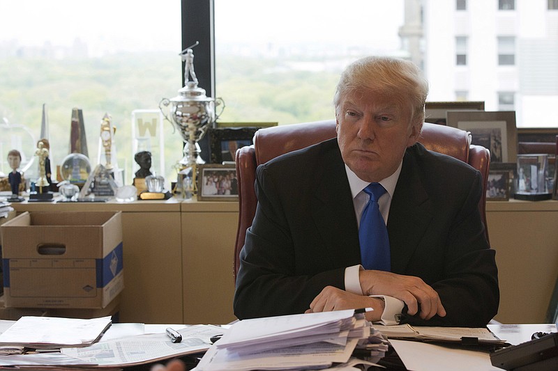 
              FILE - In this May 10,,2016 file photo, Republican presidential candidate Donald Trump is photographed during an interview with The Associated Press in his office at Trump Tower in New York. Trump holds his first presidential fundraisers this week, in New Mexico and Los Angeles. The events directly benefit his campaign, but he doesn’t see it that way. (AP Photo/Mary Altaffer, File)
            