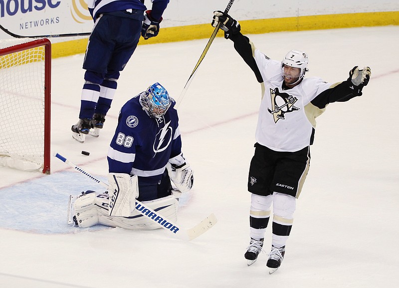 Pittsburgh Penguins center Matt Cullen (7) celebrates a goal by teammate Sidney Crosby (87), as Tampa Bay Lightning goalie Andrei Vasilevskiy (88), of Russia, remains kneeling on the ice, during the second period of Game 6 of the NHL hockey Stanley Cup Eastern Conference finals Tuesday, May 24, 2016, in Tampa, Fla.
