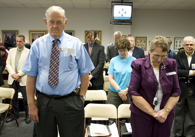 
              FILE - In this Sept. 24, 2010 file photo, Anthony Bruner and Mary Lou Bruner, right, pray at the start of a meeting of the Texas State Board of Education to discuss Islam and Christianity in textbooks in Austin, Texas. Mary Lou Bruner, a retired Texas schoolteacher who claims President Barack Obama is a gay prostitute is the Republican front-runner in a primary runoff for a seat on the influential state education board. Bruner is back on the ballot Tuesday, May 24, 2016, after nearly clinching the Republican nomination outright in March. (Jay Janner/Austin American-Statesman via AP, File)  AUSTIN CHRONICLE OUT, COMMUNITY IMPACT OUT, INTERNET AND TV MUST CREDIT PHOTOGRAPHER AND STATESMAN.COM, MAGS OUT; MANDATORY CREDIT
            