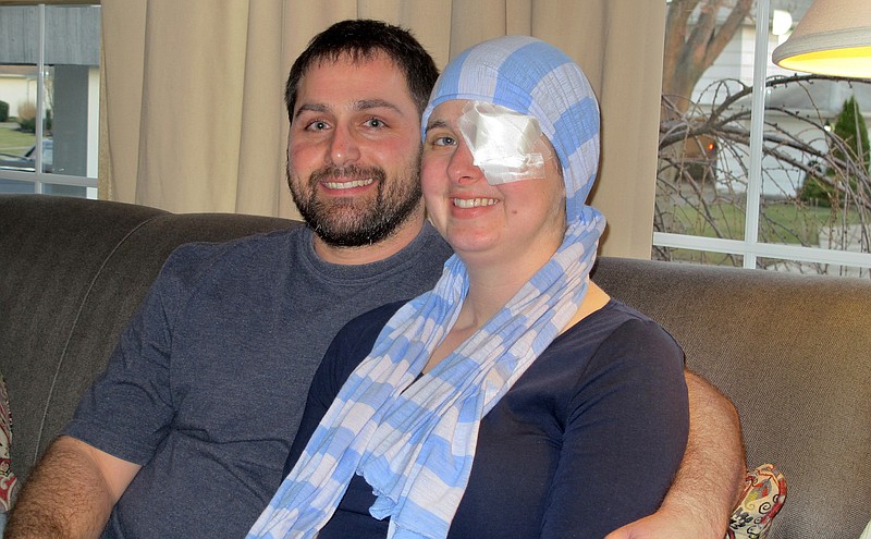 Shortly after learning she was pregnant, Kim Vaillancourt, who has aggressive brain cancer but is foregoing treatment until her baby is born, wears an eyepatch now to improve her vision and a scarf because some of the hair on her head was shaved, but is postponing the chemotherapy and radiation, considered her best defense against the cancer, until after the baby's birth. (AP Photo/Carolyn Thompson)