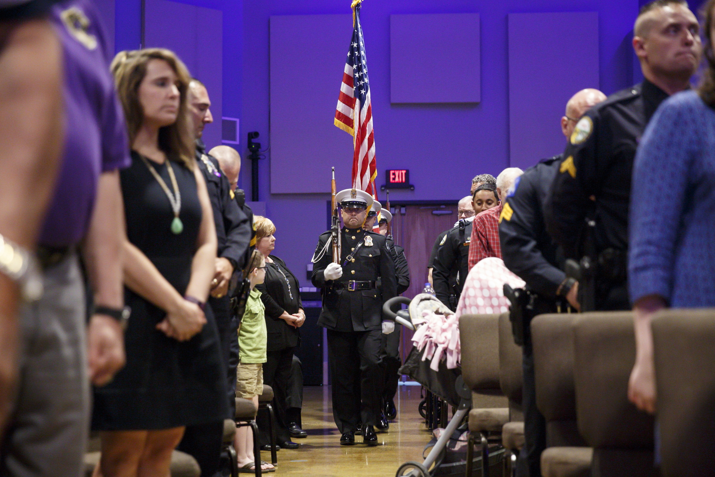 A color guard marches down an aisle to begin the Chattanooga Police Department's annual awards ceremony held at Calvary Chapel on Thursday, May 26, 2016, in Chattanooga, Tenn. In addition to normal awards, officers were awarded for their response to last year's July 16 shootings at two military facilities in Chattanooga.