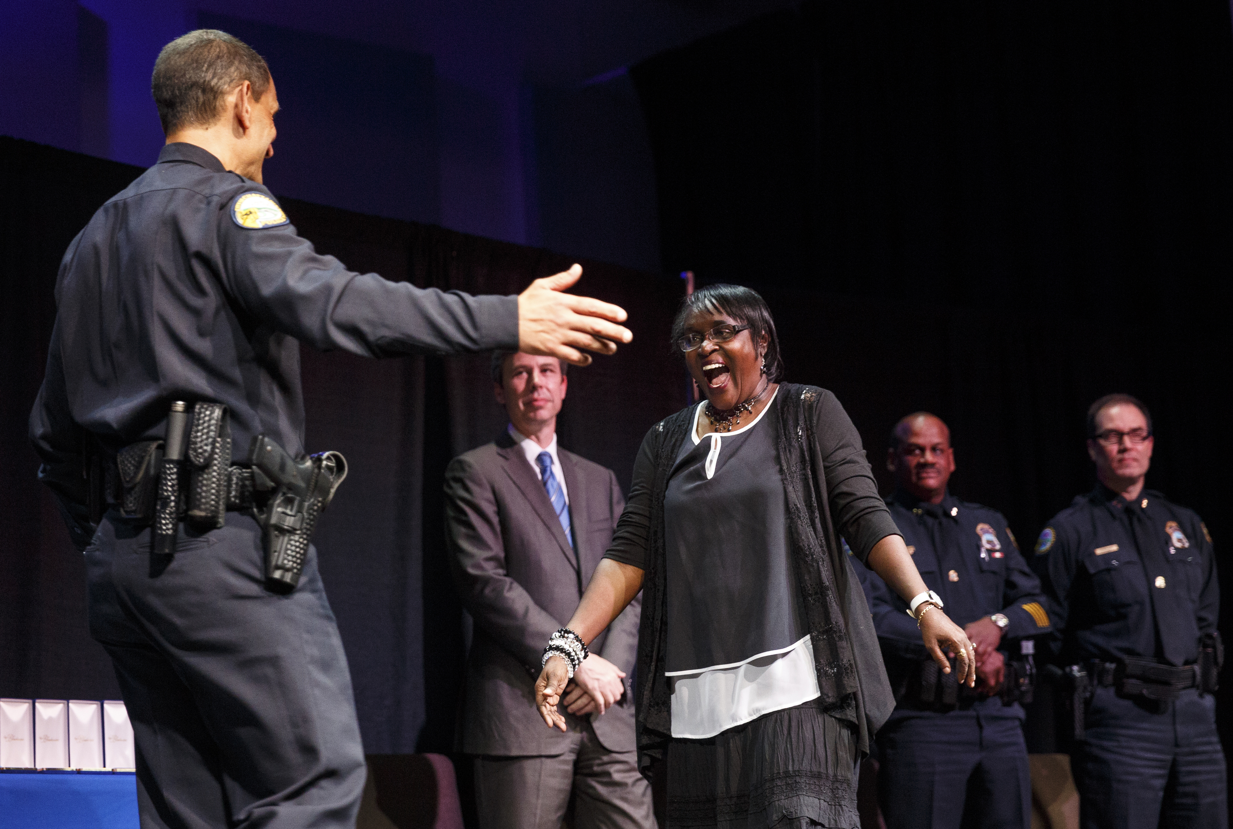 Chief Fred Fletcher, left, moves to hug Brenda Conger before presenting her the CPAAA Member of the Year award at the Chattanooga Police Department's annual awards ceremony held at Calvary Chapel on Thursday, May 26, 2016, in Chattanooga, Tenn. In addition to normal awards, officers were awarded for their response to last year's July 16 shootings at two military facilities in Chattanooga.