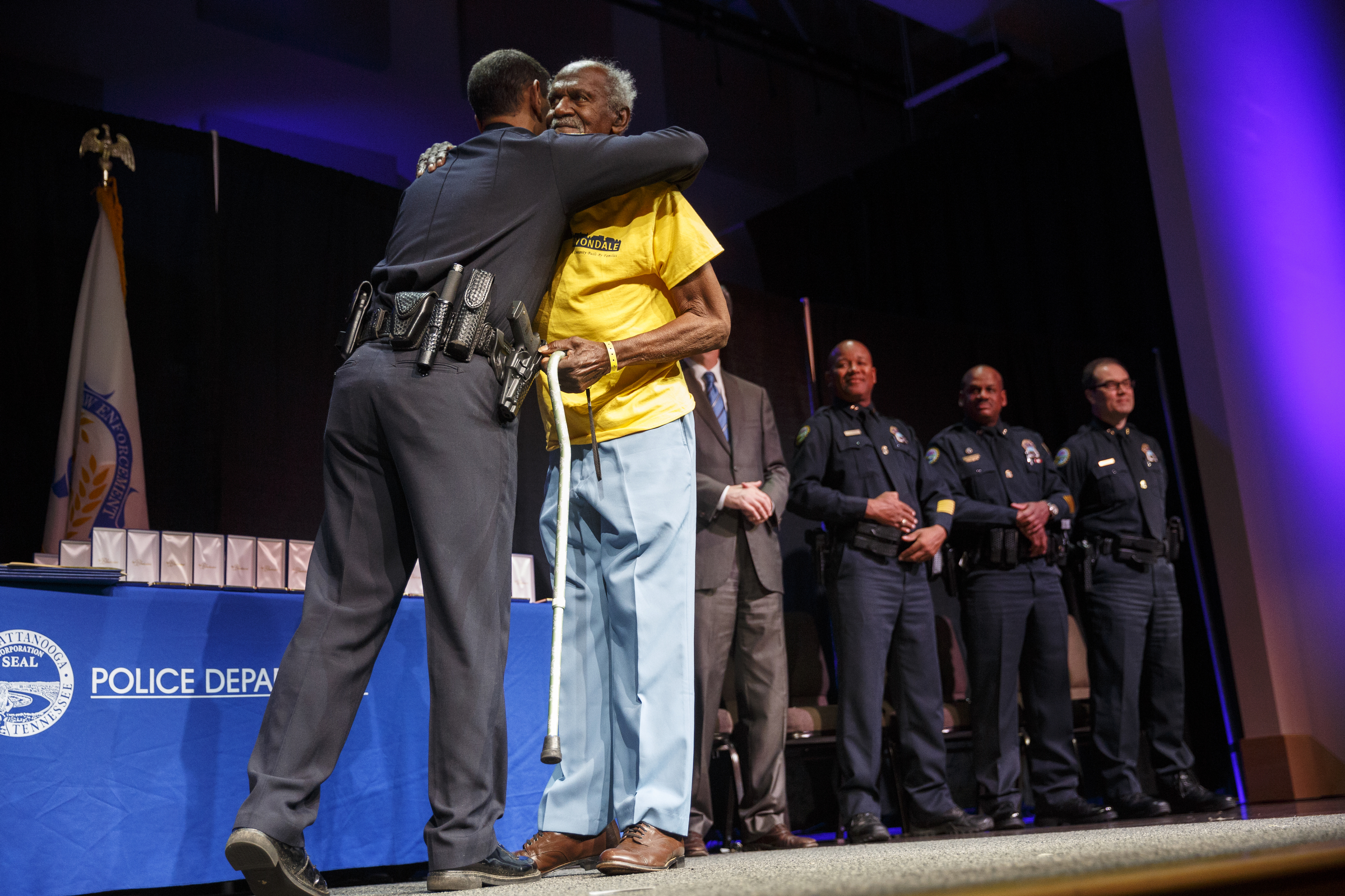 Chief Fred Fletcher, left, hugs Lawrence Curry, the area's first black constable, before presenting him with a community partner award during the Chattanooga Police Department's annual awards ceremony held at Calvary Chapel on Thursday, May 26, 2016, in Chattanooga, Tenn. In addition to normal awards, officers were awarded for their response to last year's July 16 shootings at two military facilities in Chattanooga.