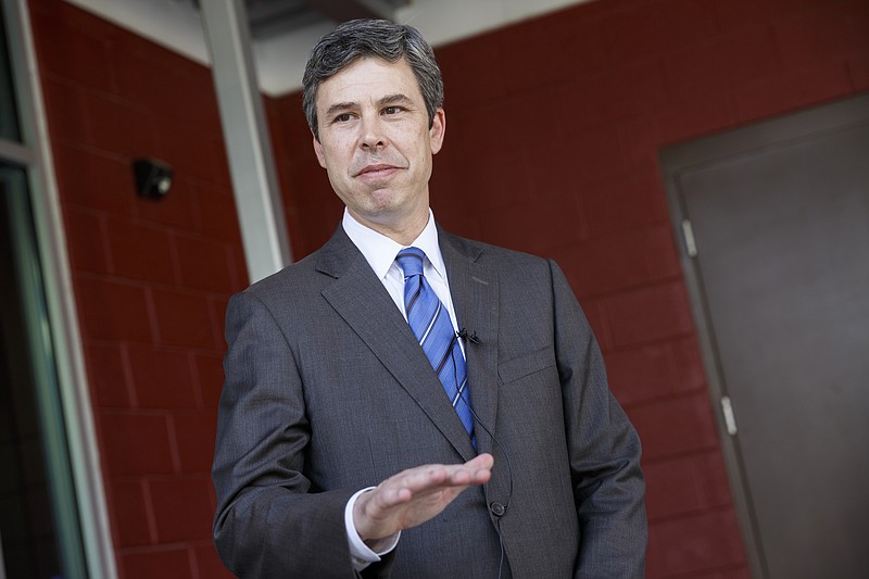 Mayor Andy Berke speaks to media outside Calvary Chapel about a domestic assault case involving his advisor Lacie Stone and her husband Bobby after the mayor appeared at the Chattanooga Police Department's annual awards ceremony on Thursday, May 26, 2016, in Chattanooga, Tenn. Mayor Berke declined to answer questions about the case, citing its ongoing nature.