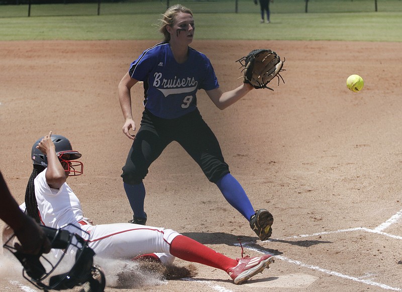GPS's Hannah Kincer (9) waits for a throw from her catcher as Baylor's Cheyenne Lindsey (1) safely slides into home during the 2016 TSSAA Division II Class AA Girls Softball Tournament at the Starplex in Murfreesboro, Tenn., on May 26, 2016.