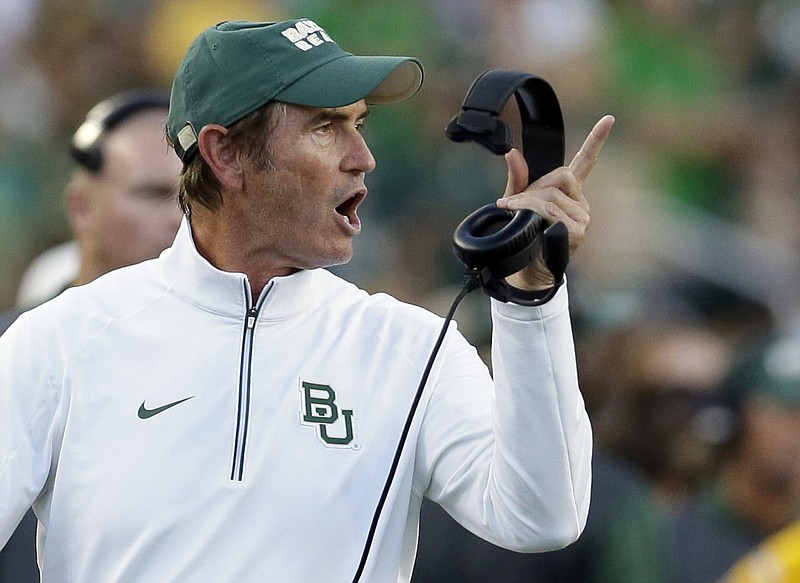 
              FILE - In this Sept. 12, 2015, file photo, Baylor coach Art Briles yells from the sideline during the first half of an NCAA college football game against Lamar in Waco, Texas. Baylor University's board of regents says it will fire Briles and re-assign university President Kenneth Starr in response to questions about its handling of sexual assault complaints against players.  The university said in a statement Thursday, May 26, 2016, that it had suspended Briles "with intent to terminate."  Starr will leave the position of president on May 31, but the school says he will serve as chancellor. (AP Photo/LM Otero, File)
            