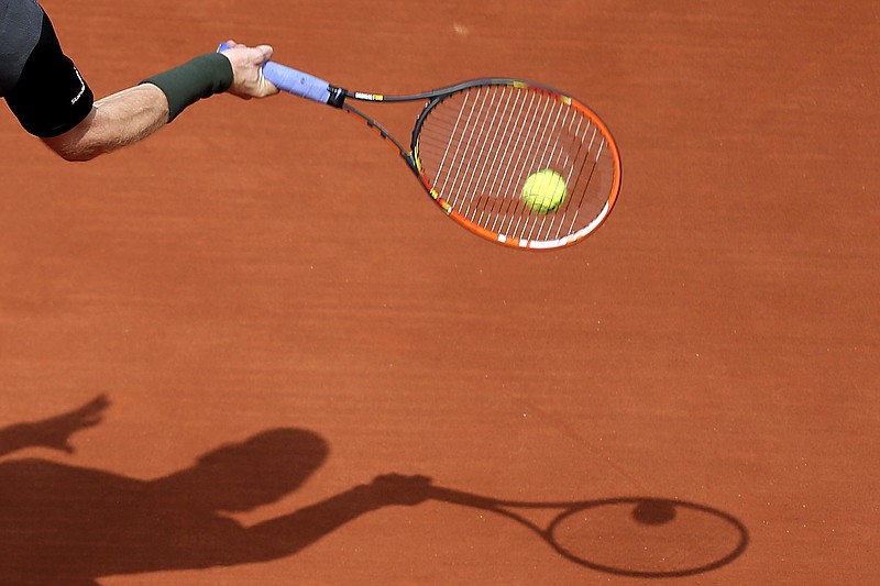 
              Britain's Andy Murray returns the ball to France's Mathias Bourgue during their second round match of the French Open tennis tournament at the Roland Garros stadium, Wednesday, May 25, 2016 in Paris.  (AP Photo/David Vincent)
            