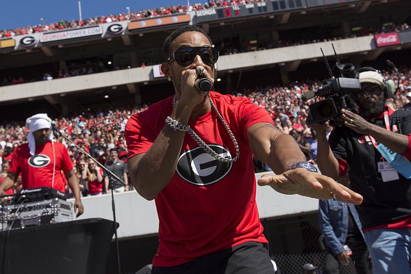 Georgia athletic director Greg McGarity has apologized for last month's G-Day spring game performing agreement with Ludacris, pictured. The contract included the university providing condoms and liquor to the Atlanta-based rapper.