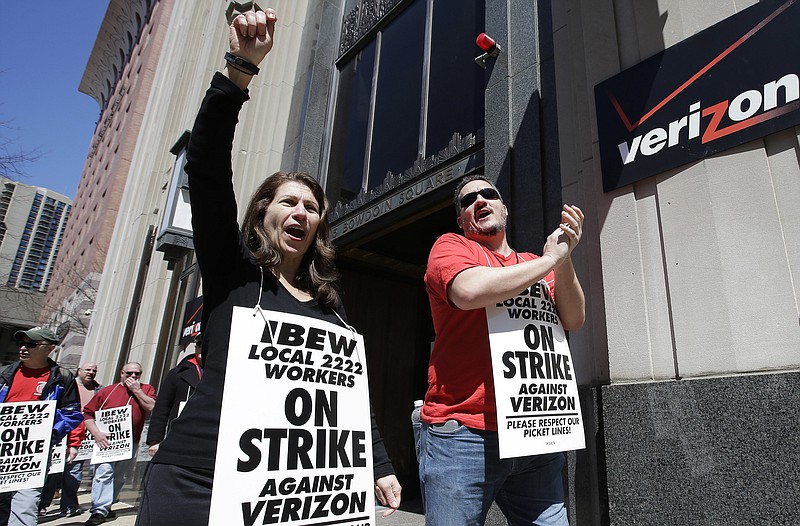 
              FILE - In this April 13, 2016 file photo, Verizon workers picket outside one of the company's facilities in Boston. Striking Verizon employees may be back to work next week after the company and its unions reached an agreement in principle, Friday, May 17,  for a four-year contract. About 39,000 Verizon Communications Inc. landline and cable employees in nine eastern states and Washington, D.C., have been on strike since April. They had been working without a contract since last August. (AP Photo/Steven Senne)
            