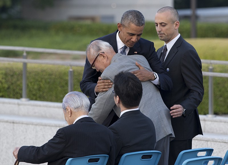 
              U.S. President Barack Obama hugs Shigeaki Mori, an atomic bomb survivor; creator of the memorial for American WWII POWs killed at Hiroshima, during a ceremony at Hiroshima Peace Memorial Park in Hiroshima, western Japan, Friday, May 27, 2016. Obama on Friday became the first sitting U.S. president to visit the site of the world's first atomic bomb attack, bringing global attention both to survivors and to his unfulfilled vision of a world without nuclear weapons. (AP Photo Carolyn Kaster)
            