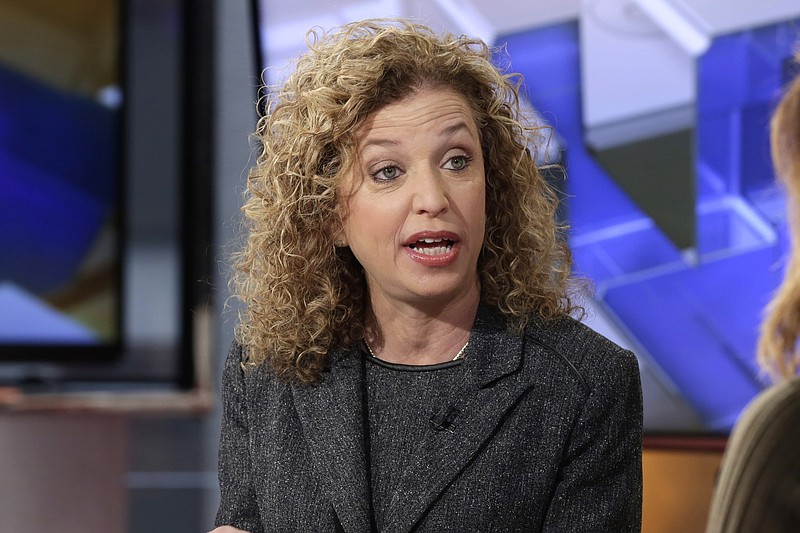 
              In this photo taken March 21, 2016, Democratic National Committee (DNC) Chair, Rep. Debbie Wasserman Schultz, D-Fla is interviewed in New York. Seeking to defuse tensions, the DNC said Friday, May 27, 2016, it will hold public hearings around the country to develop the platform for its summer convention, a focal point for supporters of presidential candidate Bernie Sanders. Wasserman Schultz announced that a 15-member platform drafting committee will hold hearings in Washington on June 8-9, Phoenix on June 17-18, St. Louis on June 24-25 and Orlando, Florida, on July 8-9, about two weeks before the Philadelphia convention. (AP Photo/Richard Drew)
            