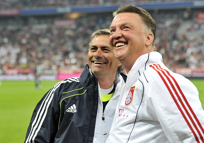 
              FILE - In this Friday, Aug. 13, 2010 file photo, Munich's head coach Louis van Gaal, right, and Madrid's head coach Jose Mourinho smile prior to the friendly soccer match between FC Bayern Munich and Real Madrid in Munich, southern Germany. Manchester United has fired manager Louis van Gaal after two turbulent years at the English Premier League club, it was reported on Monday, May 23, 2016. Former Chelsea manager Jose Mourinho is expected to replace Van Gaal.  (AP Photo/Kerstin Joensson, File)
            