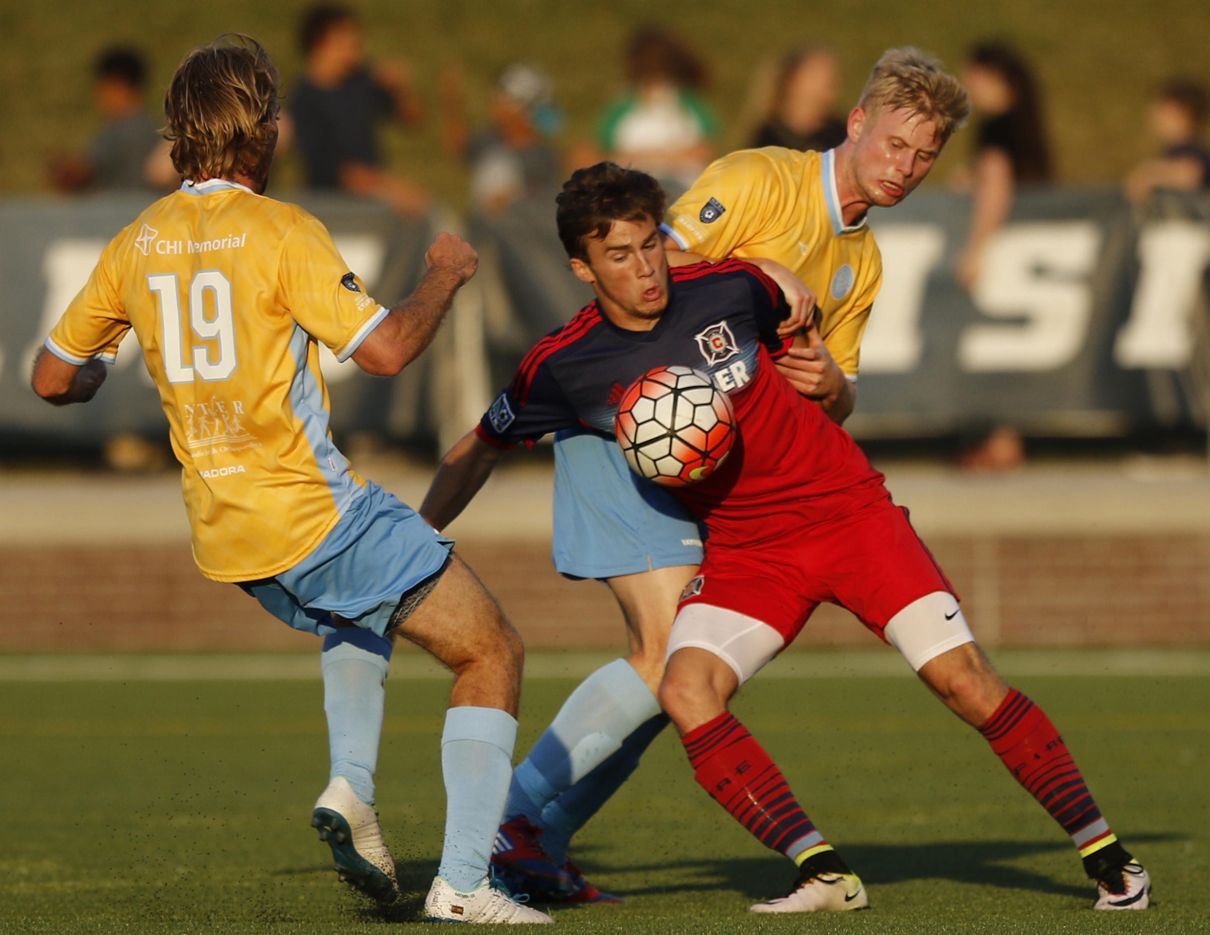 CFC's Juan Hernandez (19) and Sindre Welo pressure Chicago's Brody Kraussel, center, during Chattanooga FC's Hank Steinbrecher Cup championship match against the Chicago Fire at Finley Stadium on Saturday, May 28, 2016, in Chattanooga, Tenn.