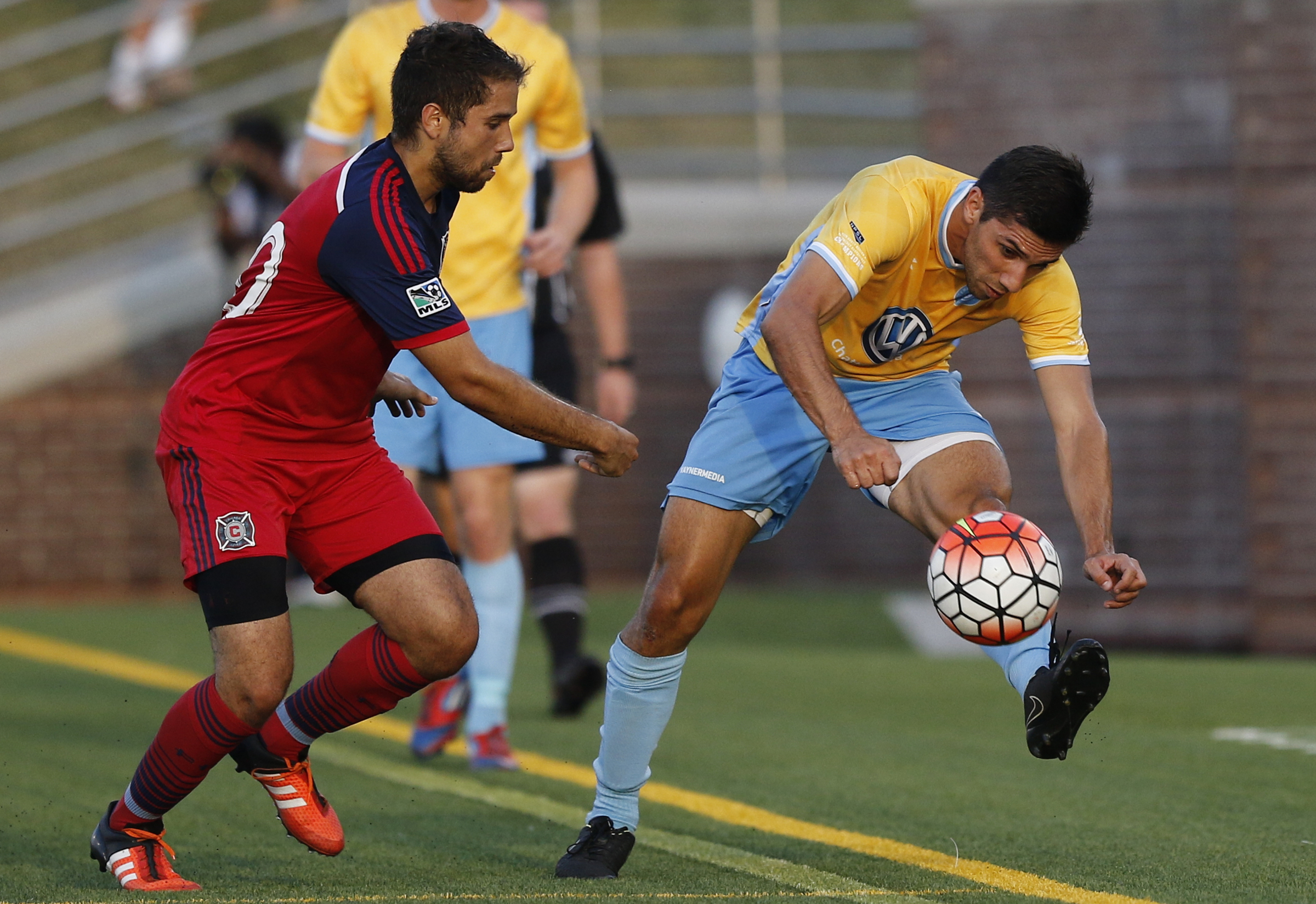 CFC's Luis Trude keeps the ball inbounds ahead of Chicago's Mikey Jimenez during Chattanooga FC's Hank Steinbrecher Cup championship match against the Chicago Fire at Finley Stadium on Saturday, May 28, 2016, in Chattanooga, Tenn.