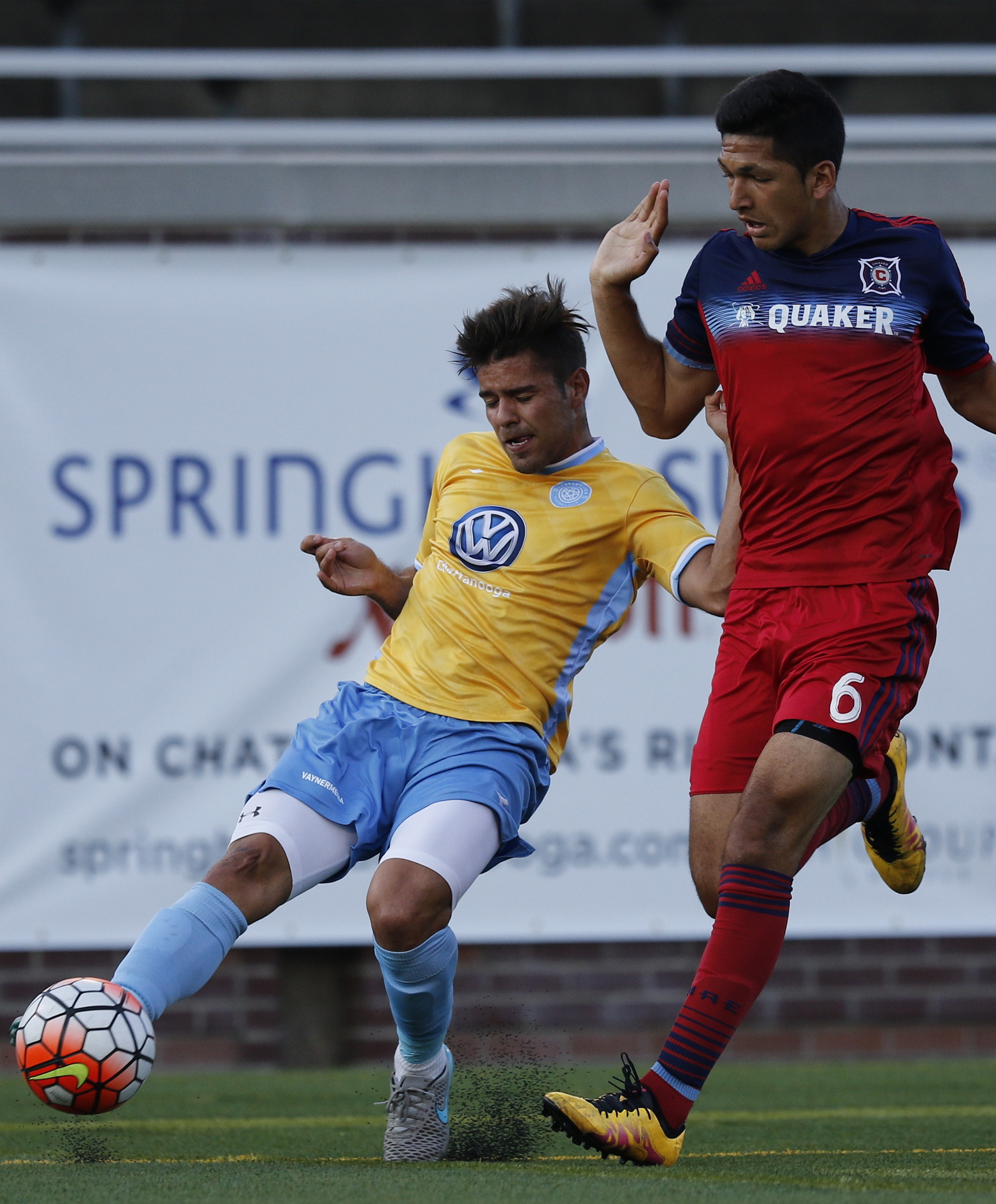 CFC's Samuel Goni, left, takes a shot around Chicago's Mauricio Pineda during Chattanooga FC's Hank Steinbrecher Cup championship match against the Chicago Fire at Finley Stadium on Saturday, May 28, 2016, in Chattanooga, Tenn.