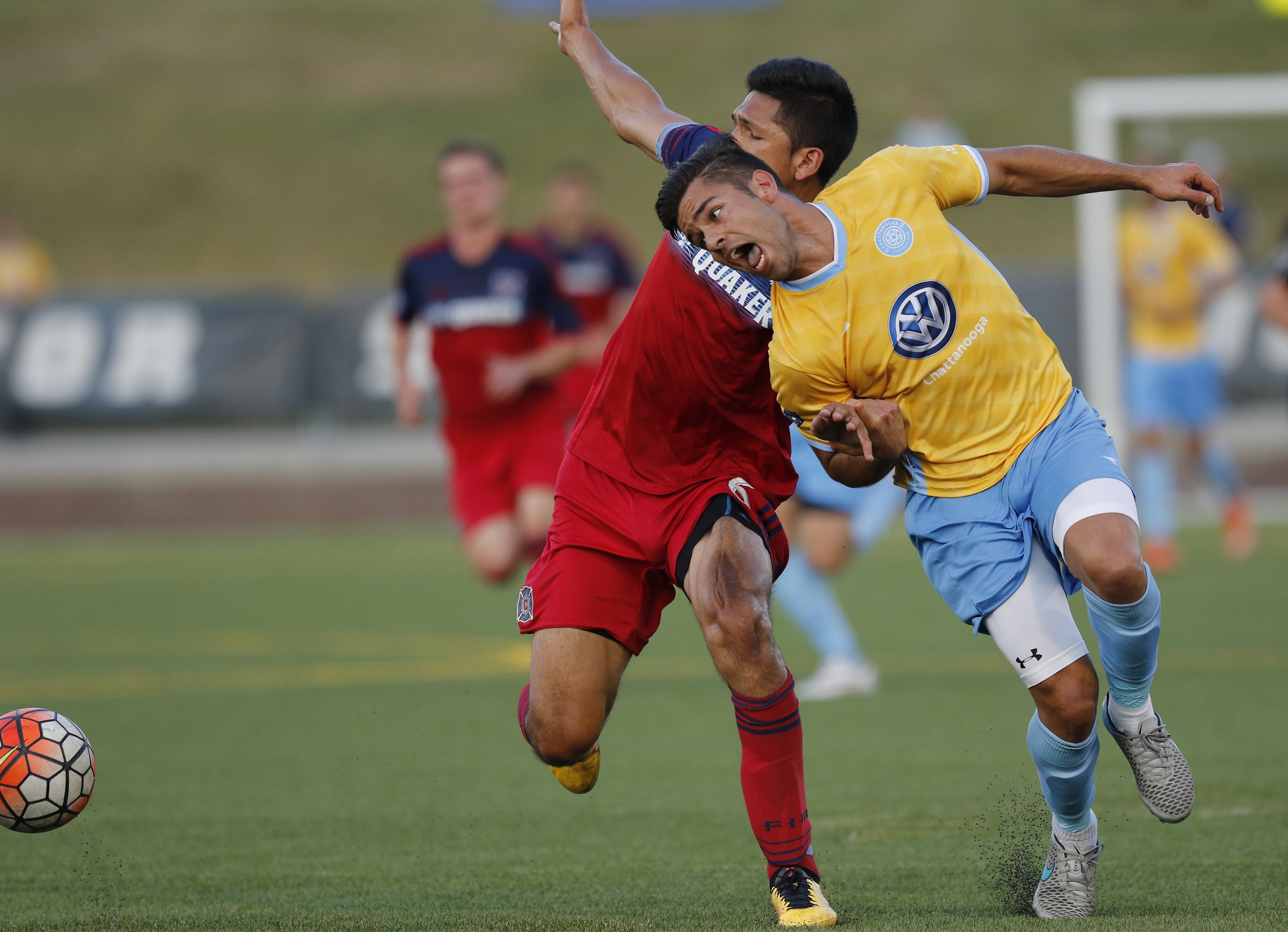 CFC's Samuel Goni, right, watches his pass go around Chicago's Mauricio Pineda during Chattanooga FC's Hank Steinbrecher Cup championship match against the Chicago Fire at Finley Stadium on Saturday, May 28, 2016, in Chattanooga, Tenn.