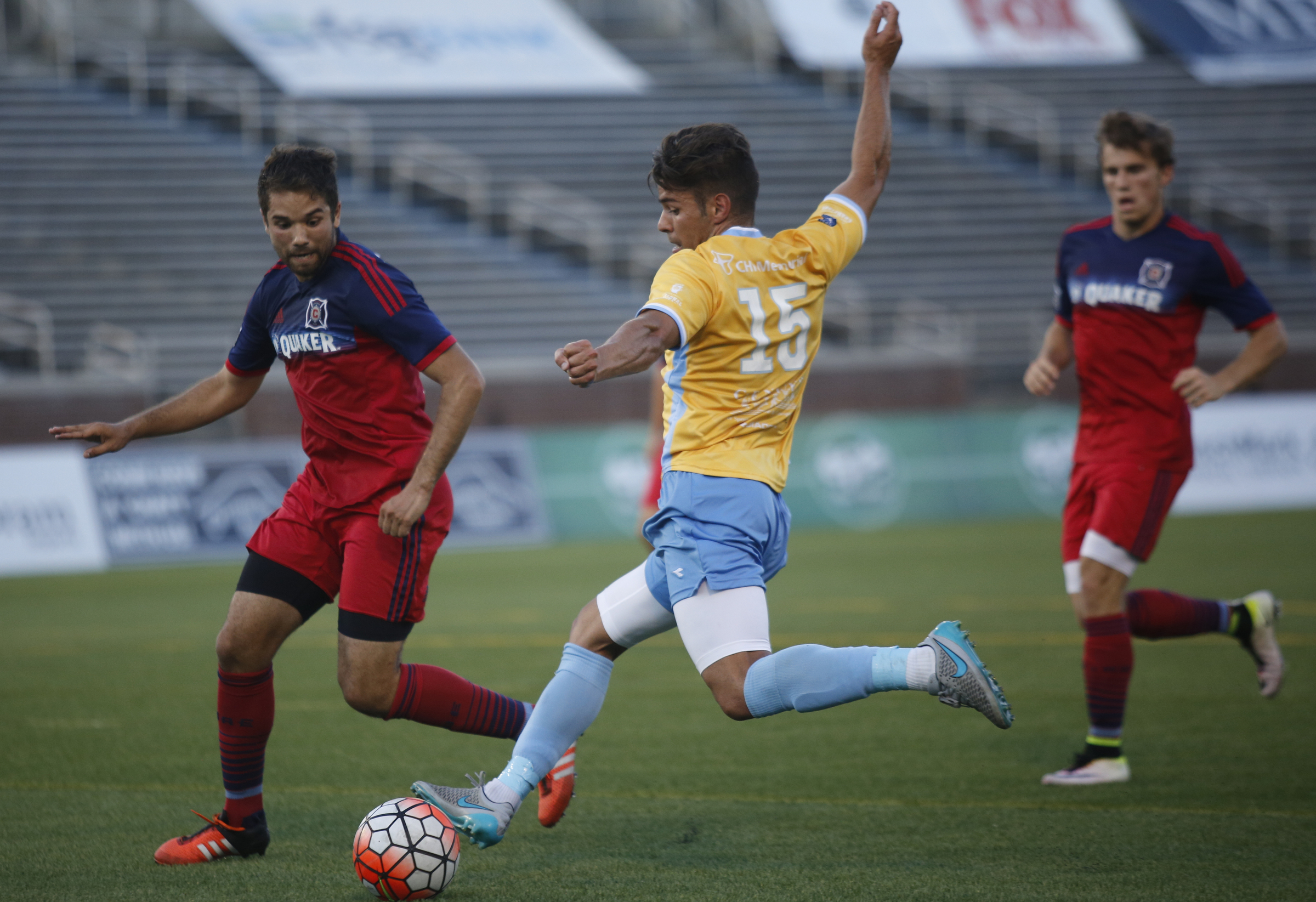 CFC's Samuel Goni (15) takes a shoot around Chicago's Elliot Collier during Chattanooga FC's Hank Steinbrecher Cup championship match against the Chicago Fire at Finley Stadium on Saturday, May 28, 2016, in Chattanooga, Tenn.