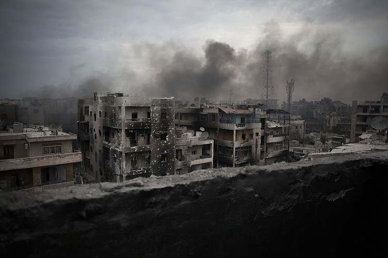 
              FILE - In this Tuesday, Oct. 2, 2012 file photo, smoke rises over Saif Al Dawla district, in Aleppo, Syria. Islamic State militants entered a Syrian opposition stronghold in the country's north on Saturday, clashing with rebels on the edges of the town as the extremist group built on its most significant advance near the Turkish border in two years, Syrian opposition groups and IS media said. (AP Photo/ Manu Brabo, File)
            