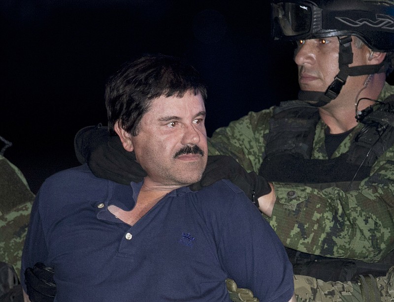 
              FILE - In this Jan. 8, 2016 file photo, Joaquin "El Chapo" Guzman is made to face the press as he is escorted to a helicopter in handcuffs by Mexican soldiers and marines at a federal hangar in Mexico City, Mexico. After two of Guzman's attorneys filed an appeal against the extradition request, a third lawyer, Jose Refugio Rodriguez, disavowed it on Saturday, May 28, 2016. Rodriguez said that the two lawyers who filed it are not part of the team working on the extradition case. That team is still considering the government's arguments and plans an appeal in the coming weeks that "El Chapo" will approve. (AP Photo/Marco Ugarte, File)
            
