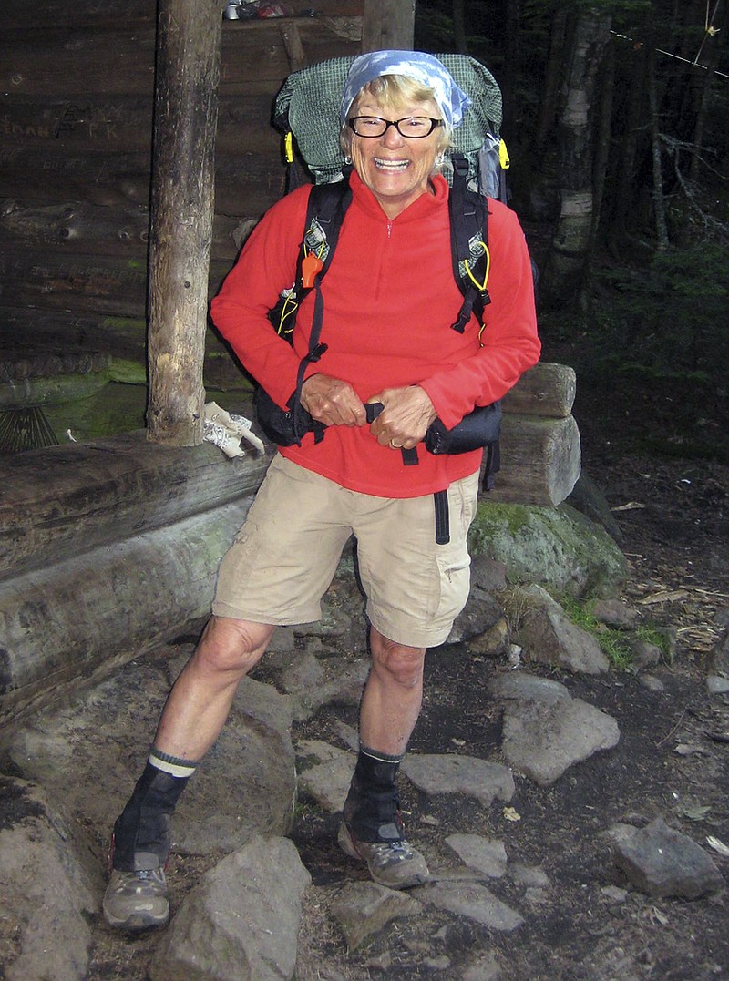 
              In this July 22, 2013 photo provided by Dorothy Boynton Rust, hiker Geraldine Largay, of Brentwood, Tenn., poses at the Poplar Ridge Shelter on the Appalachian Trail in Maine. A report released Wednesday, May 25, 2016, by the Maine Warden Service said Largay, known as Inchworm, got lost after leaving the trail that day. Documents show she survived at least 26 days after getting lost. She kept a journal of her ordeal and ultimately resigned herself to the idea she was going to die, and it could be years before her remains were located. They were found in October 2015. (Dorothy Boynton Rust via AP)
            