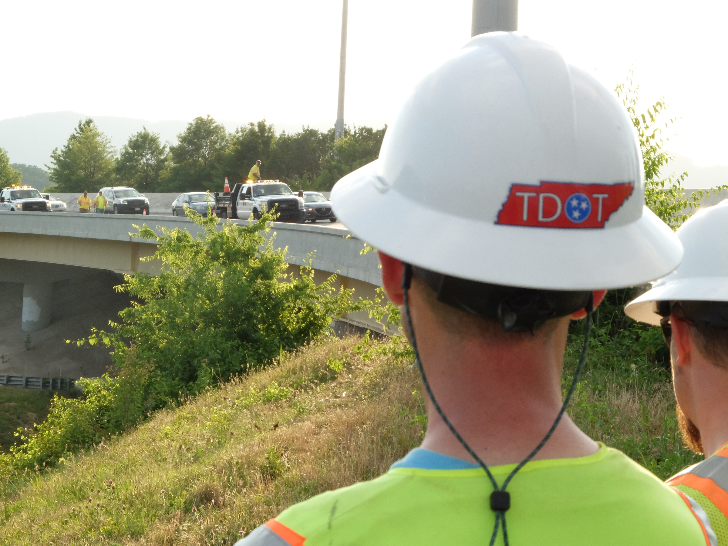 TDOT Bridge Inspector Jason Tays waits as cones are placed to close the right lane on Interstate 24 late Sunday at the U.S. Highway 27 split.