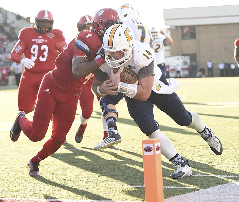 Jacob Huesman, diving for a touchdown last season, has signed with the Saskatchewan Roughriders of the Canadian Football League.