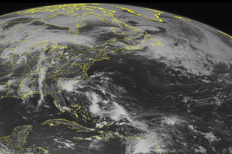 
              This NOAA satellite image taken Saturday, May 28, 2016 at 9:45 AM EDT shows Tropical Depression Two continuing to move northwest towards the North and South Carolina coastline as it is expected to slightly strengthen into a weak tropical storm before making landfall. Elsewhere, a weak frontal boundary is draped across northern portions of New England, with thunderstorms beginning to develop across New York and Pennsylvania. A broad amount of cloud cover is also observed over the Midwestern United States with a north-south oriented frontal boundary. (Weather Underground va AP)
            