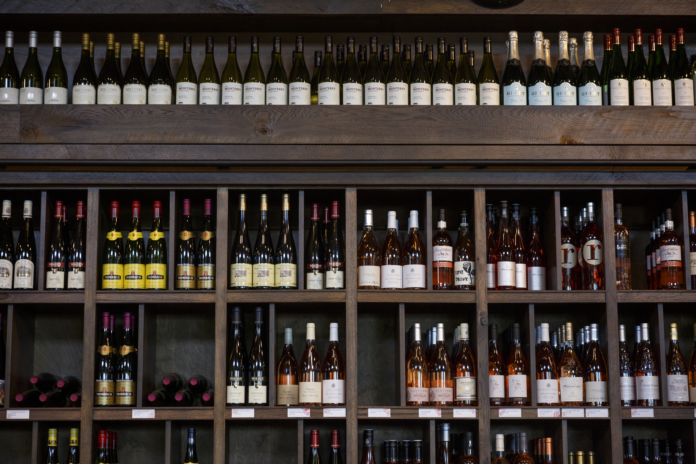 Wine bottles are displayed at Imbibe Chattanooga, a wine-focused liquor store, on Wednesday, May 25, 2016, in Chattanooga, Tenn. Beginning July 1, Tennessee grocery stores will be allowed to sell wine, but they will not be able to buy in bulk the way liquor stores can.