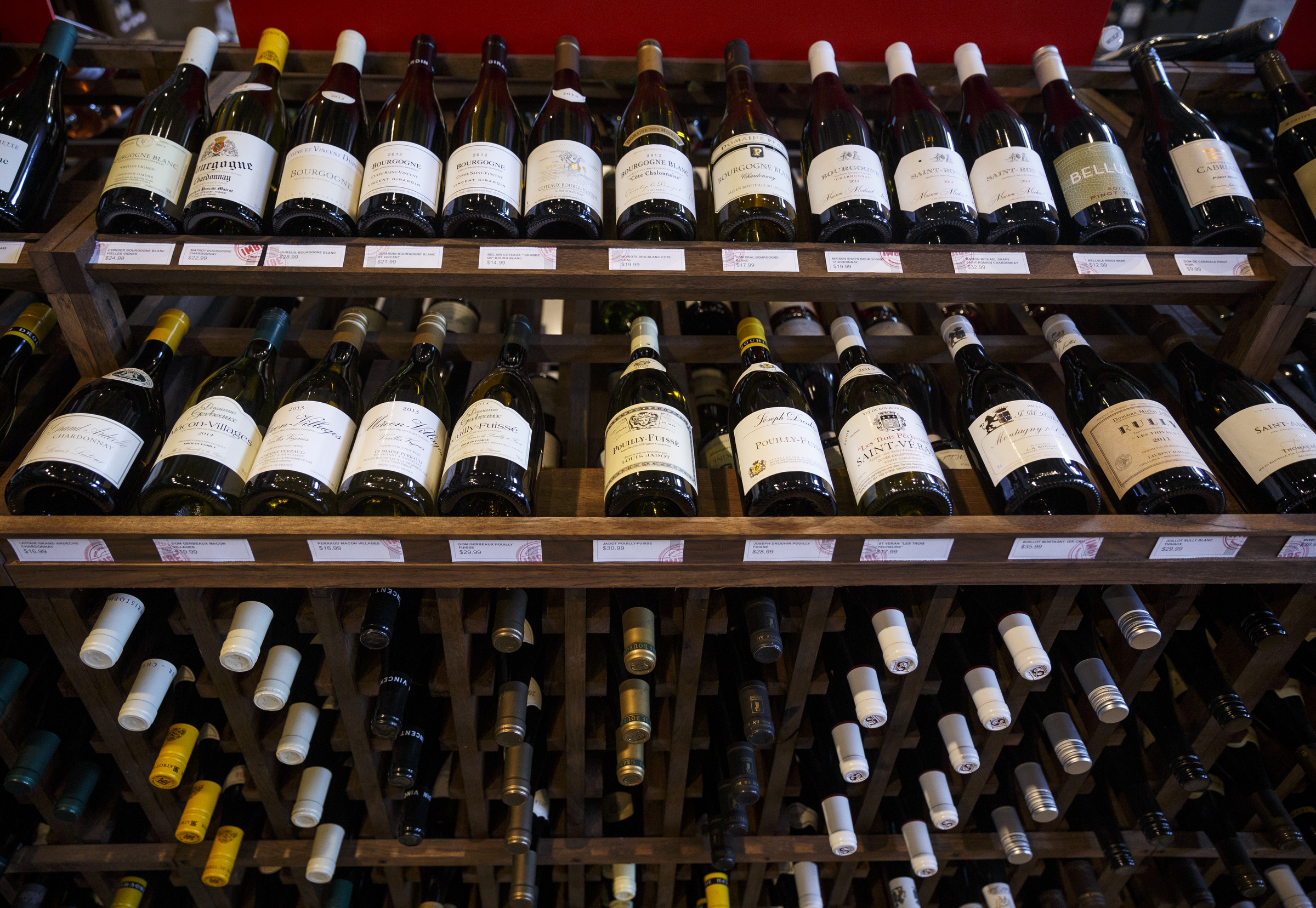 Wine bottles are displayed at Imbibe Chattanooga, a wine-focused liquor store, on Wednesday, May 25, 2016, in Chattanooga, Tenn. Beginning July 1, Tennessee grocery stores will be allowed to sell wine, but they will not be able to buy in bulk the way liquor stores can.