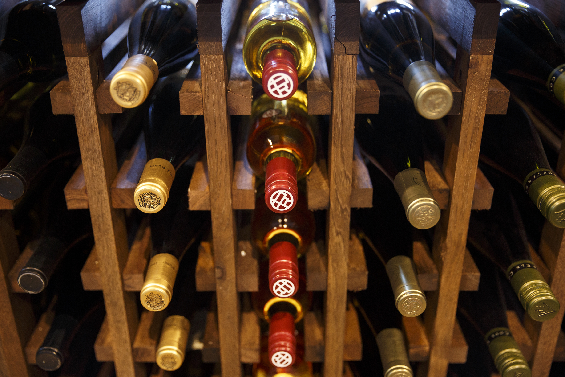 Wine bottles are displayed at Imbibe Chattanooga, a wine-focused liquor store, on Wednesday, May 25, 2016, in Chattanooga, Tenn. Beginning July 1, Tennessee grocery stores will be allowed to sell wine, but they will not be able to buy in bulk the way liquor stores can.
