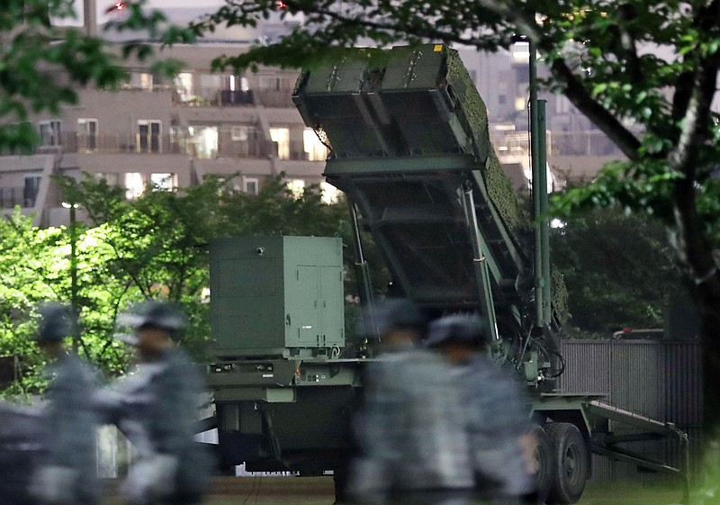 
              In this Monday, May 30, 2016 photo, Japan Self-Defense Force members walk near PAC-3 missile interceptors deployed to prepare for a possible North korean missile, at the Defense Ministry in Tokyo. A North Korean missile launch likely failed on Tuesday, according to South Korea's military, the latest in a string of high-profile failures that tempers somewhat recent worries that Pyongyang was pushing quickly toward its goal of a nuclear-tipped missile that can reach America's mainland. (Muneki Yajima/Kyodo News via AP) JAPAN OUT, MANDATORY CREDIT
            